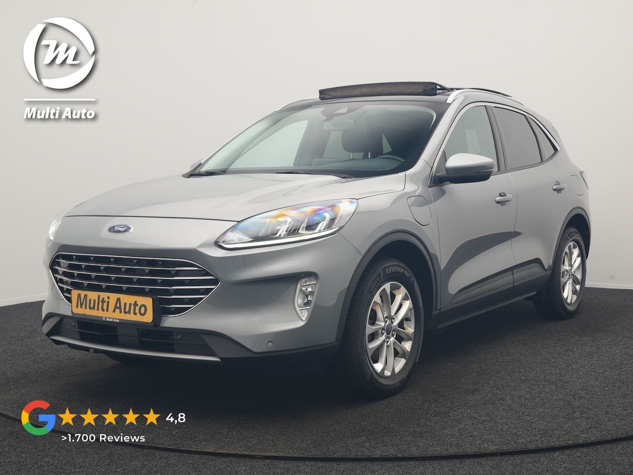 Ford Kuga - 2.5 PHEV Titanium 225pk Dealer O.H. | Trekhaak Afn. | Panodak | Camera | Stoelen & Stuur V - AutoWereld.nl