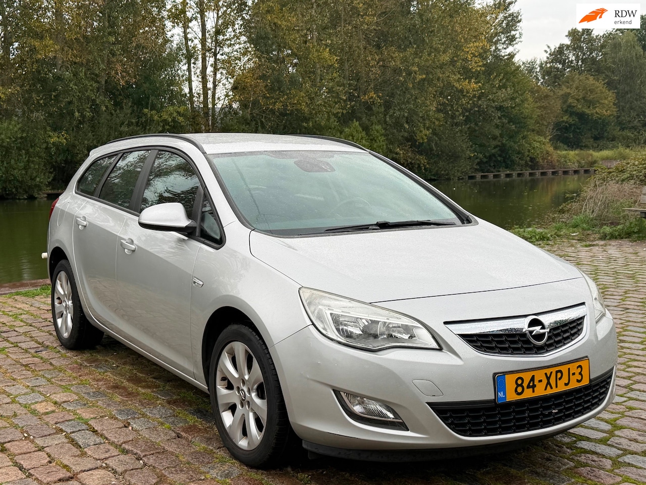 Opel Astra Sports Tourer - 1.4 Turbo Sport Dealer onderhouden Airco elek ramen cruis control navigatie cv op afst - AutoWereld.nl
