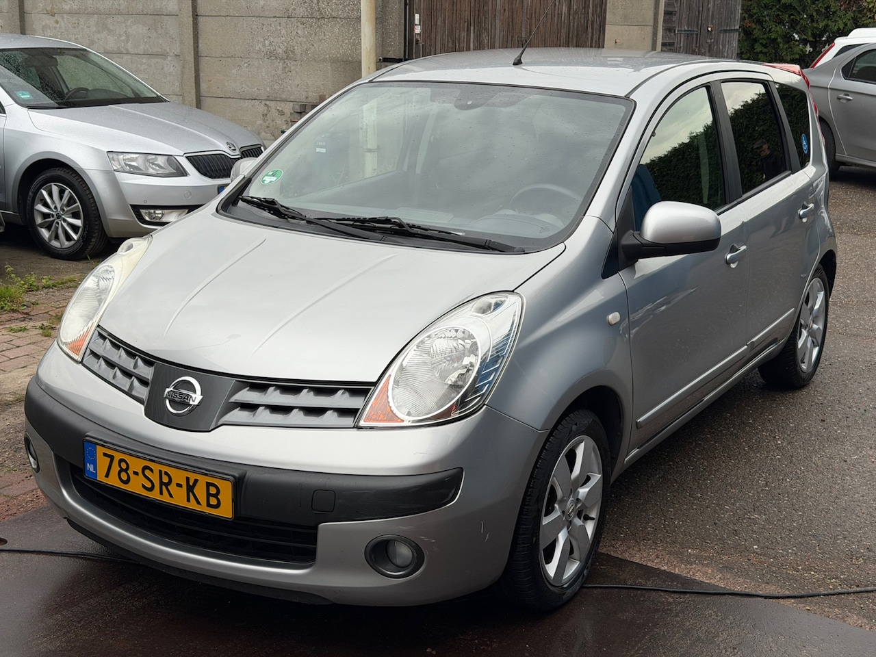 Nissan Note - 1.6 First Note Automaat Clima Cruise Trekhaak Aangepast voor Minder Validatie Stoel Omhoog - AutoWereld.nl
