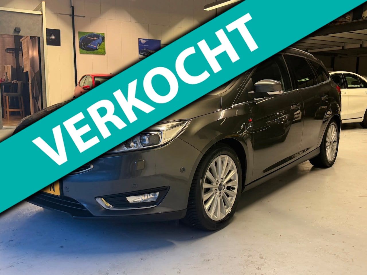 Ford Focus Wagon - 1.0 Titanium V-Max NAVI|CRUISE|VERW.STOEL|TREKH - AutoWereld.nl