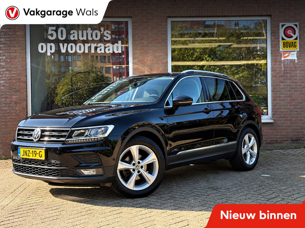 Volkswagen Tiguan - 1.5 TSI Comfortline Business | Carplay Navi | Trekhaak | Airco | Cruise | Velgen - AutoWereld.nl