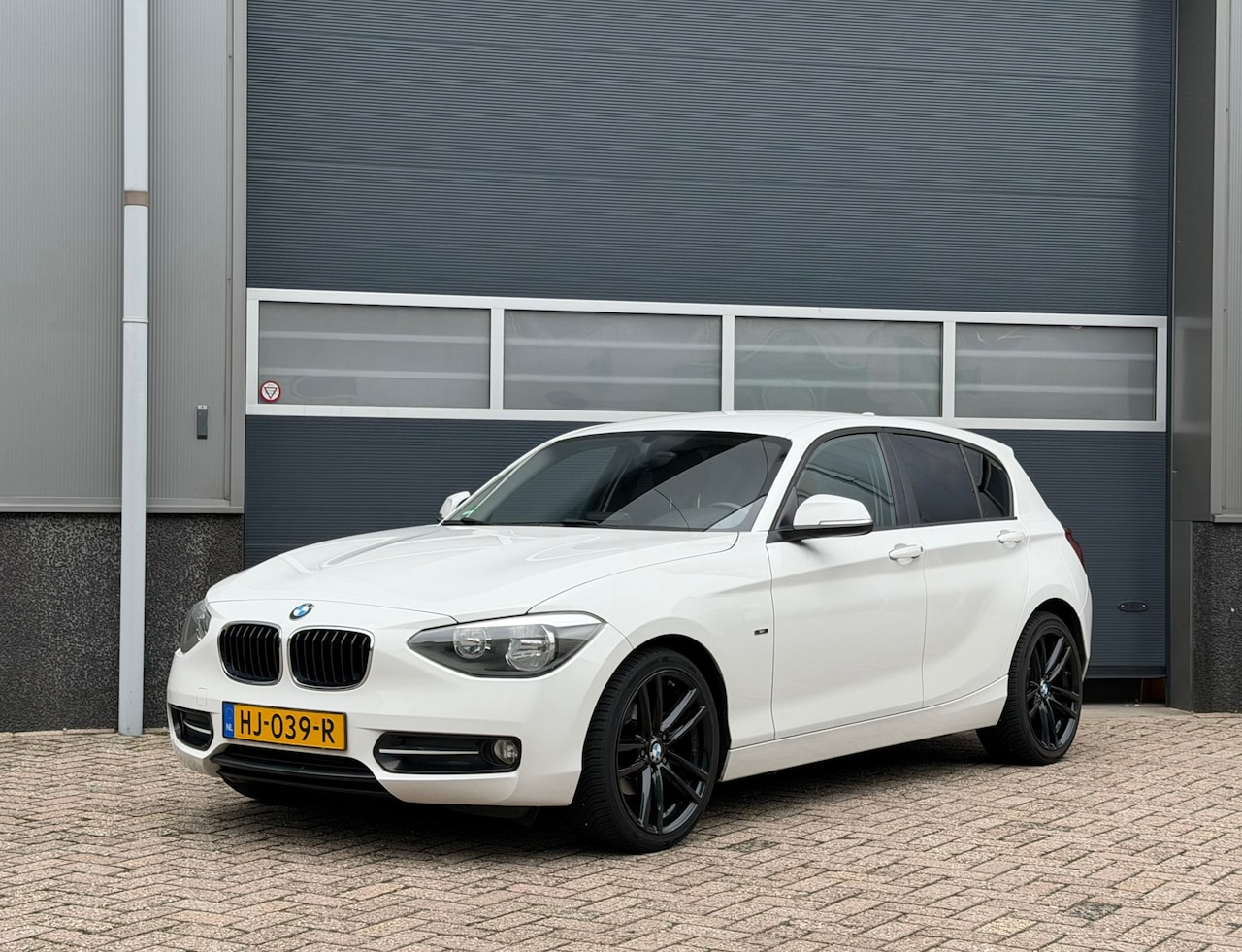 BMW 1-serie - 116i Sport bj.2015 Autom|Navi|5 Drs|Clima|Cc. - AutoWereld.nl