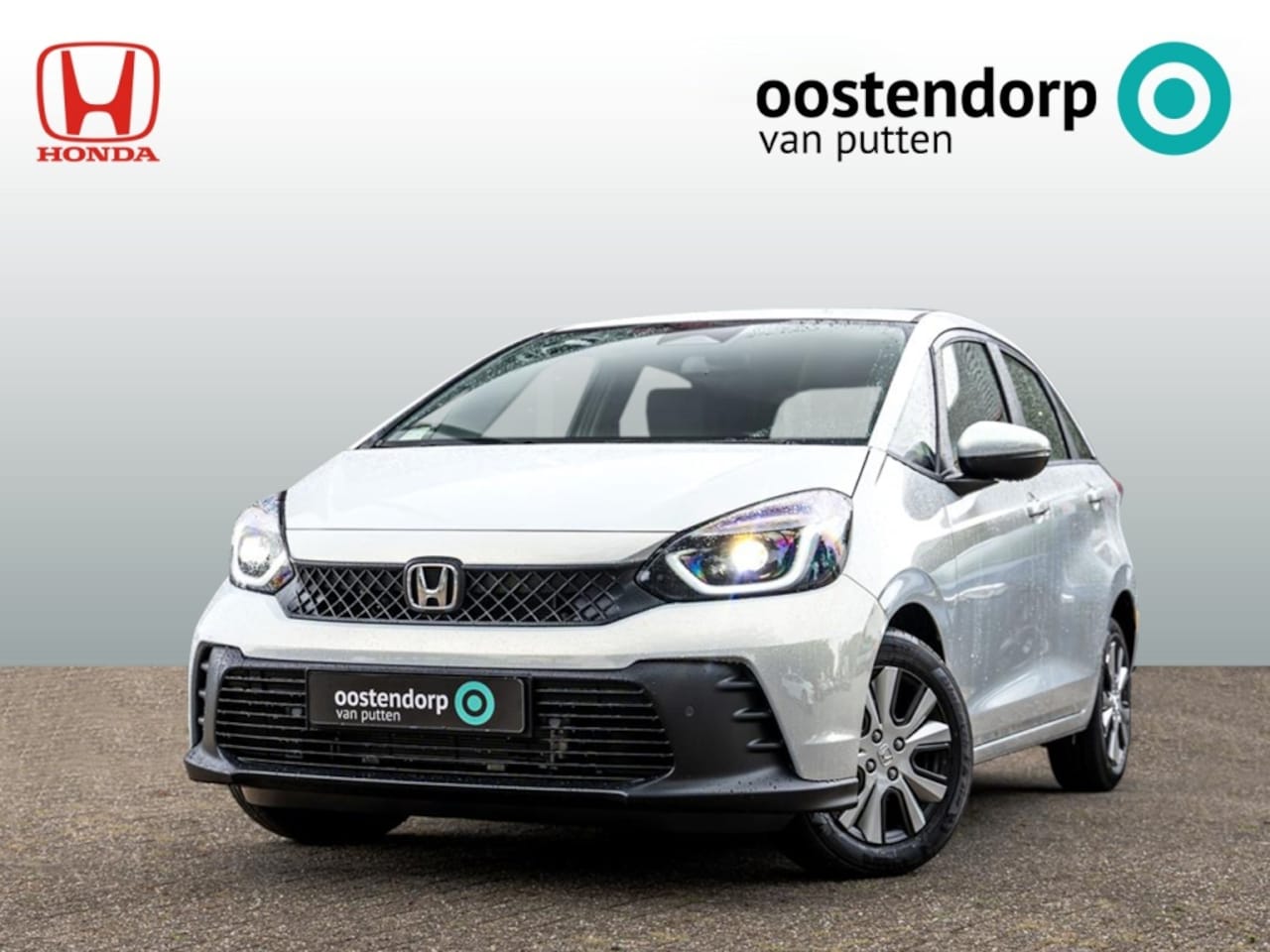 Honda Jazz - 1.5 Full Hybrid Elegance Automaat | 8 jaar garantie | Premium Sunlight Silver Metallic | S - AutoWereld.nl