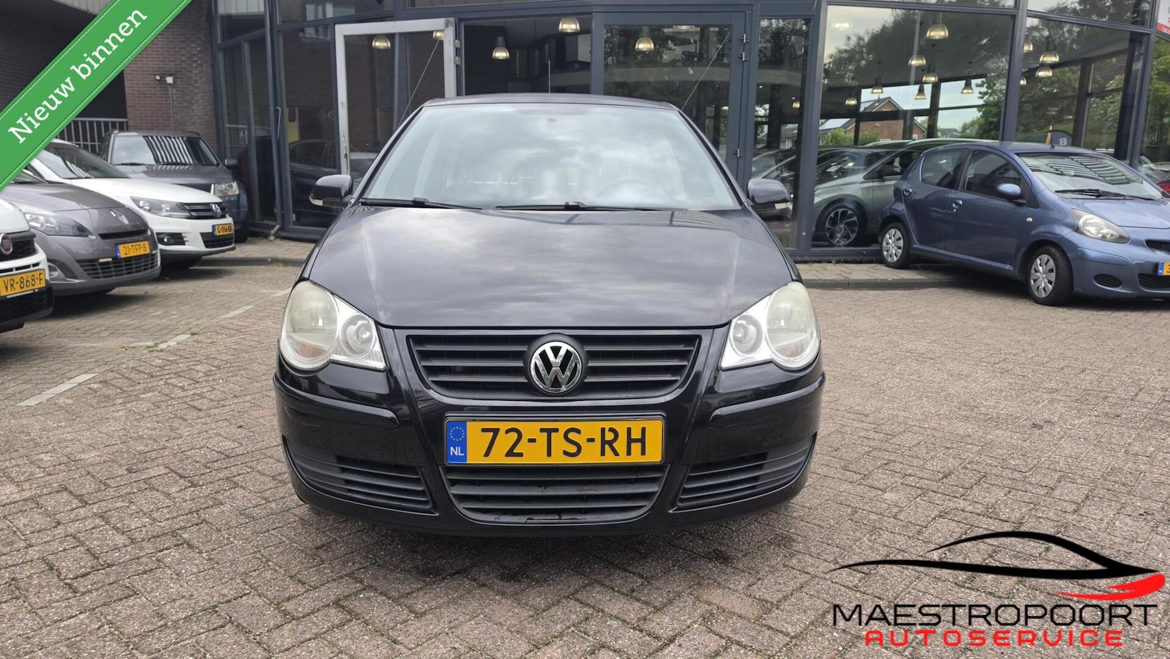 Volkswagen Polo - 1.2 Optive 5-deurs | Zwart | NAP | Airco | Jaar APK - AutoWereld.nl