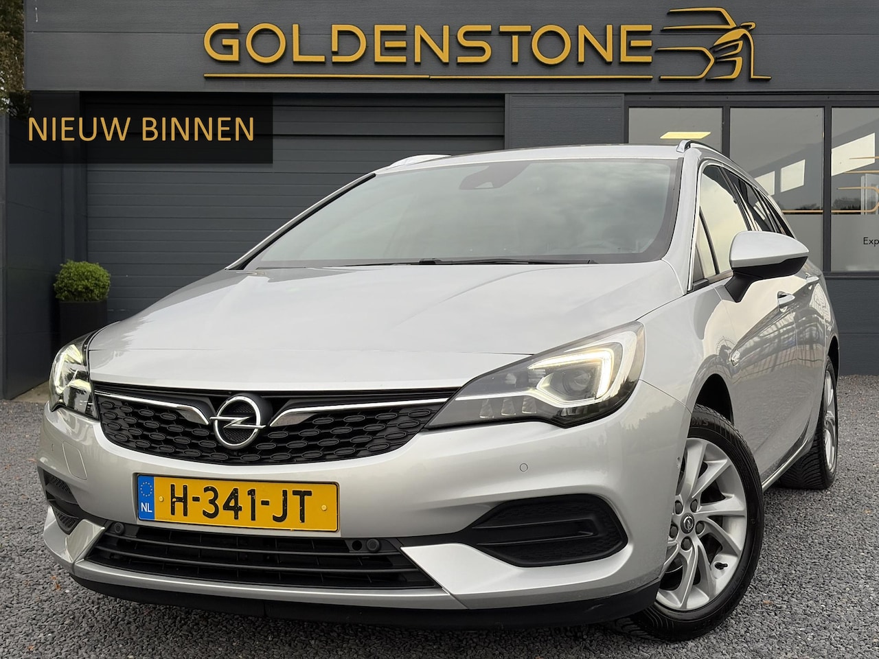Opel Astra Sports Tourer - 1.2 Elegance ✓110pk✓Camera✓Carplay✓Navi✓Halfleder✓Keyless✓Trekhaak✓Pdc V+A✓Clima✓Cruise✓El - AutoWereld.nl