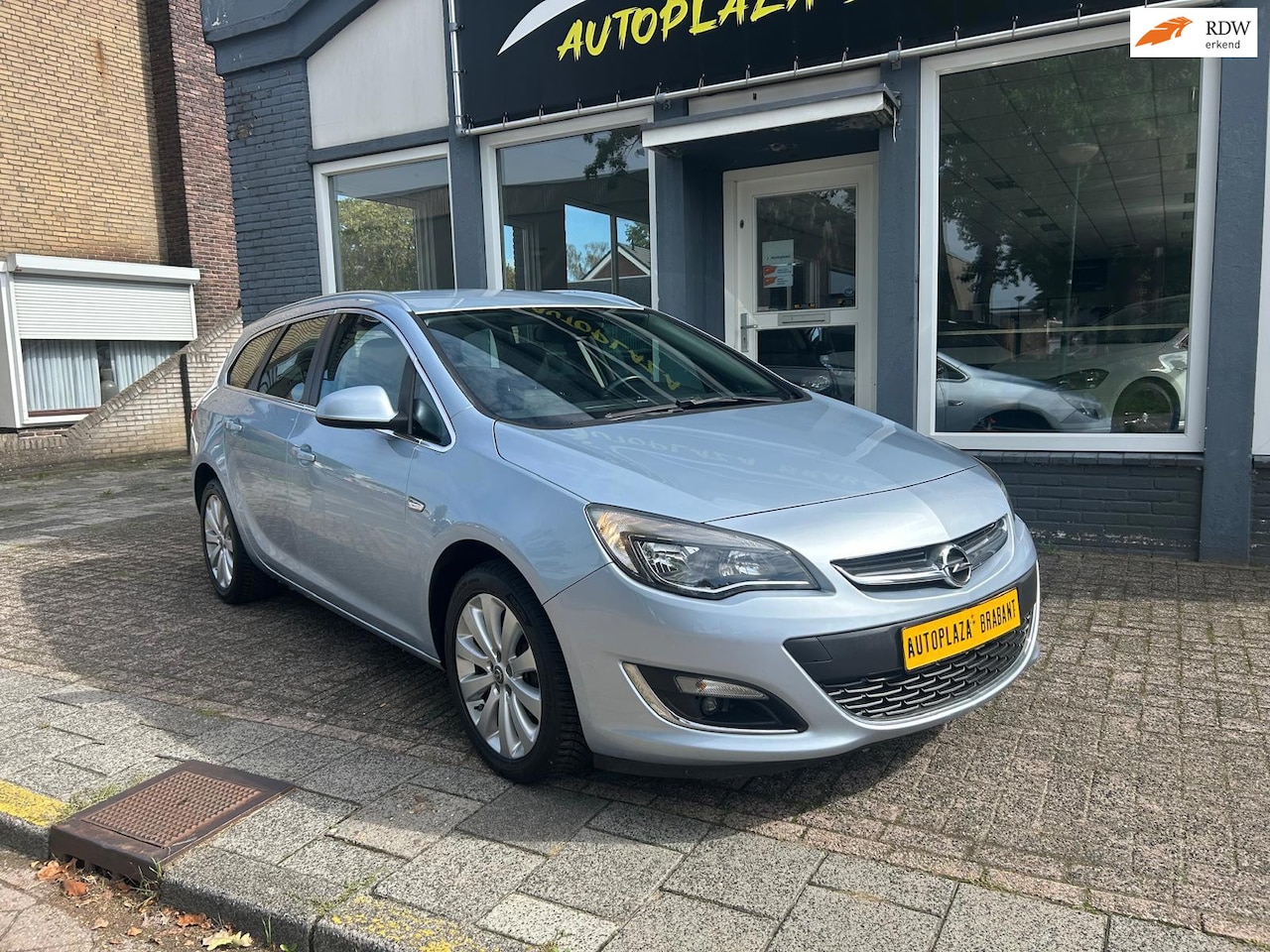 Opel Astra Sports Tourer - 1.4 Turbo Edition / NAVI / ACHTERUITRIJ CAMERA / PDC - AutoWereld.nl