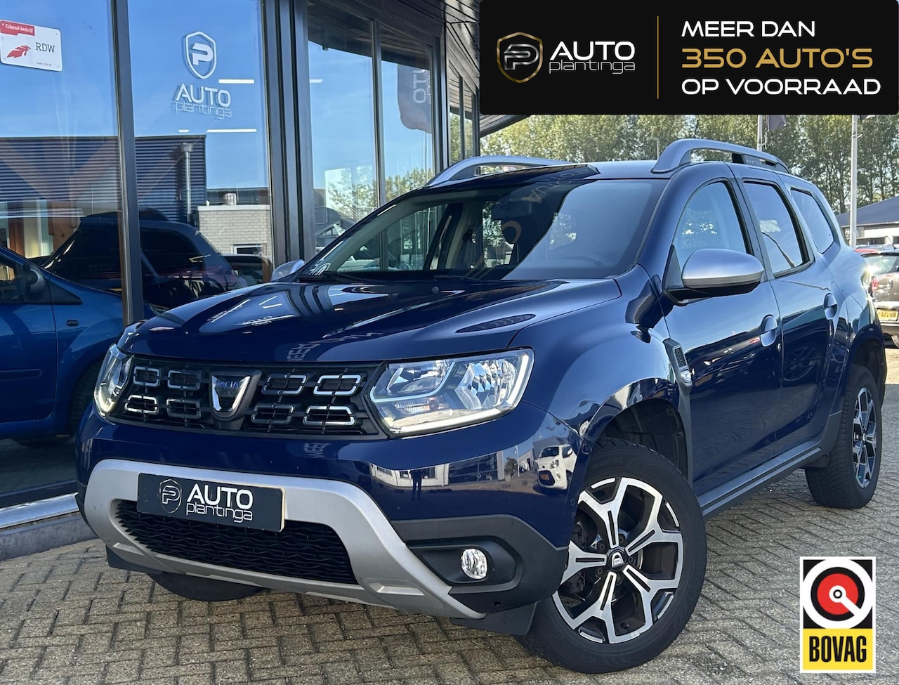 Dacia Duster - 1.3 TCe Prestige 131PK | 1e Eigenaar! | NL AUTO | NAP | Achteruitrijcamera | Navigatie | C - AutoWereld.nl