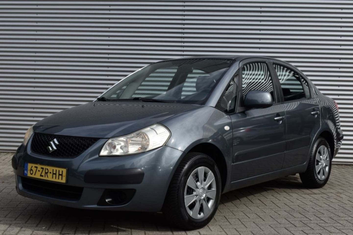 Suzuki SX4 - 1.6 COMFORT / AIRCO / TREKHAAK / AUDIO / 4-SEASON BANDEN - AutoWereld.nl