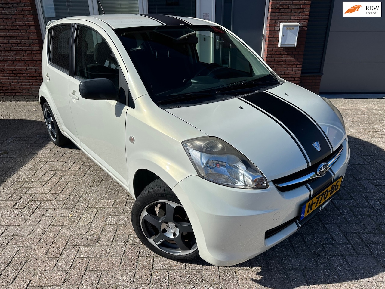 Subaru Justy - 1.0 Black & White / Airco / 5DRS / LM - AutoWereld.nl