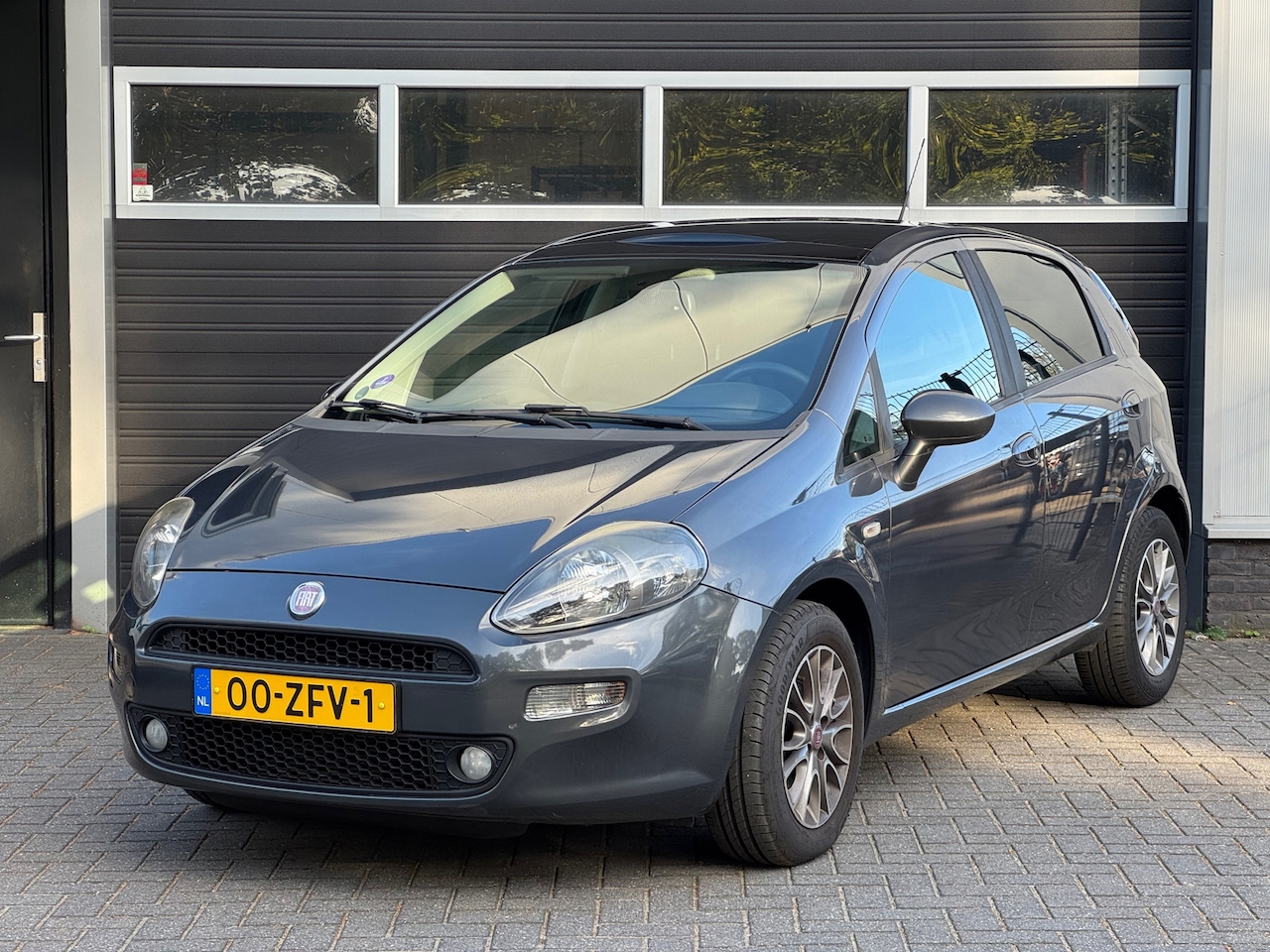 Fiat Punto Evo - 0.9 TwinAir Lounge Pano, Cruise, Climate Control, NAP - AutoWereld.nl