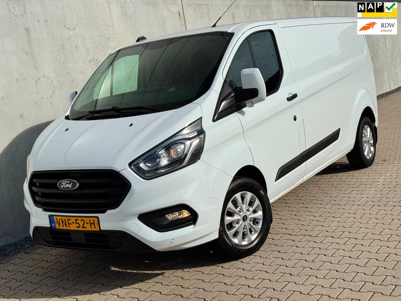 Ford Transit Custom - 2.0 TDCI L2|Navi|Carplay|Airco|16'' Velgen|NAP|LED|3Pers - AutoWereld.nl
