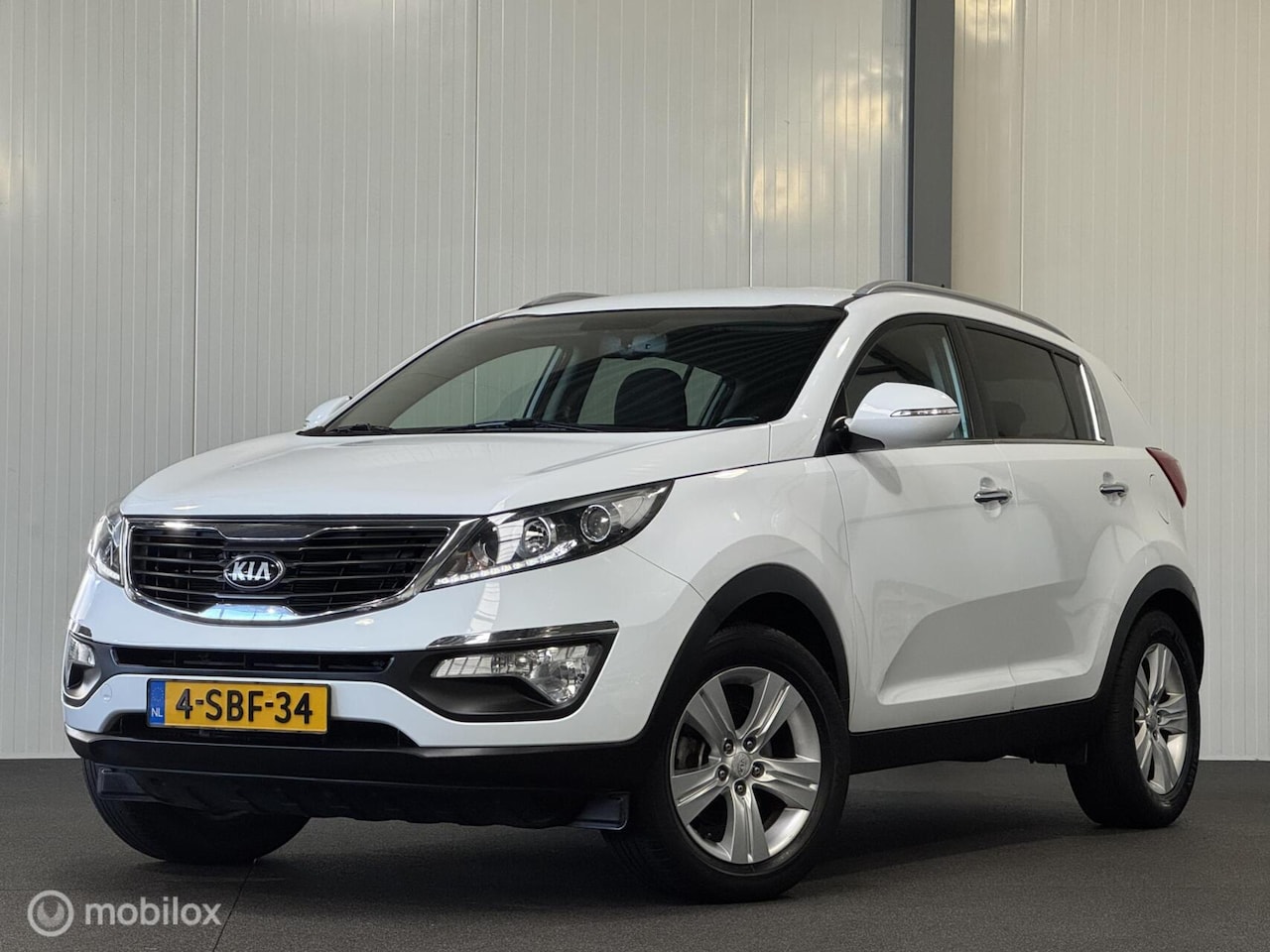 Kia Sportage - 1.6 GDI 20th Ann. [ NAP trekhaak cruise camera ] - AutoWereld.nl