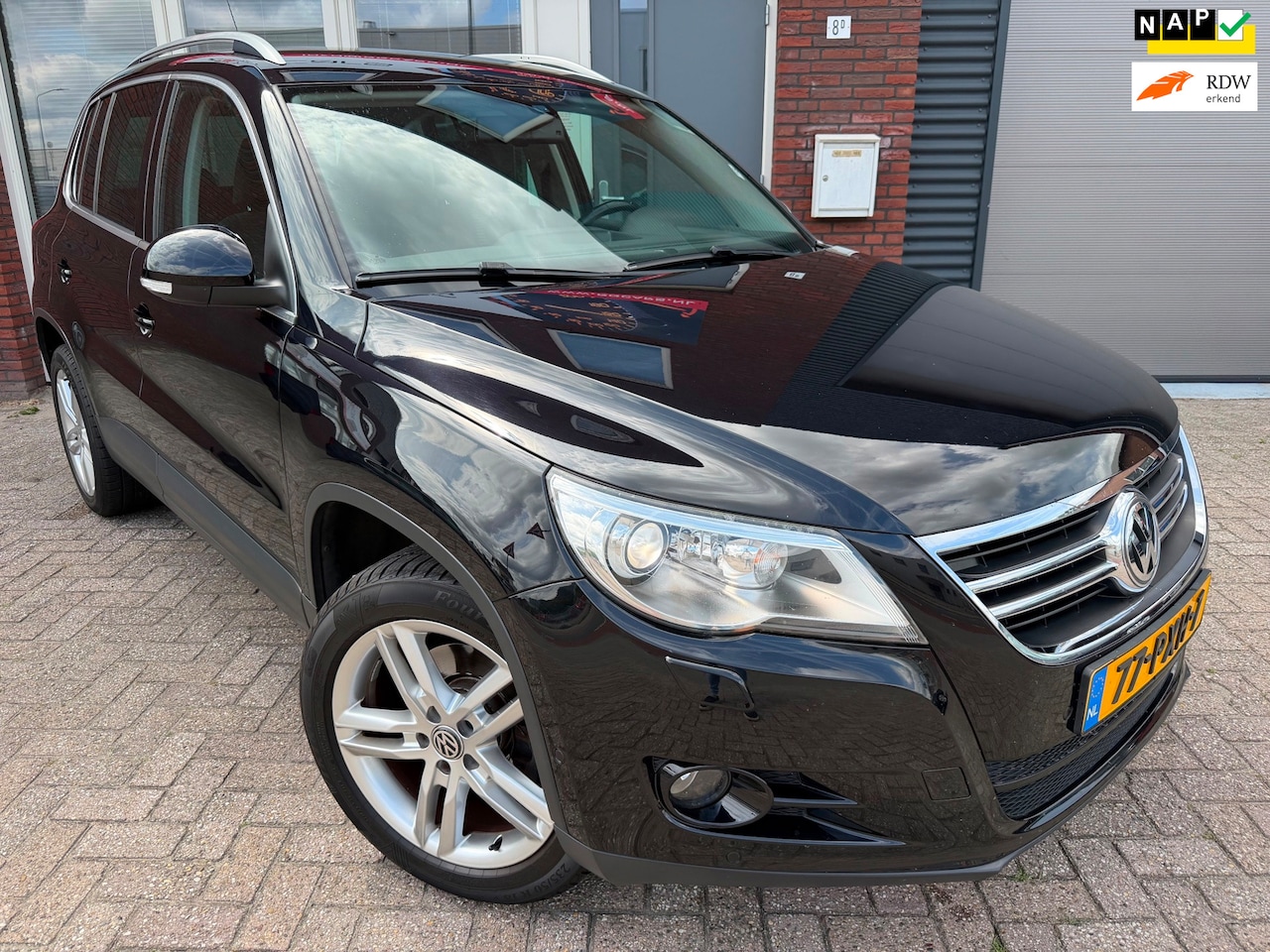 Volkswagen Tiguan - 1.4 TSI Sport&Style / Navi / Clima / Cruise / LM / NAP - AutoWereld.nl