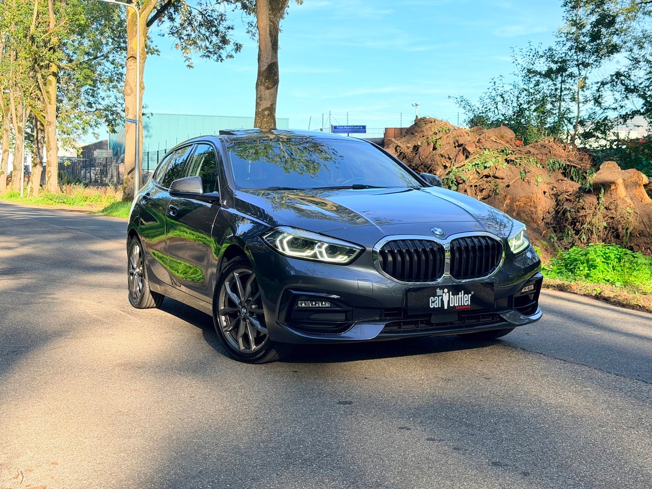 BMW 1-serie - 120i High Executive| Pano | Head-Up |Keyless|Trekhaak | Stuur-/Stoelverwarming - AutoWereld.nl