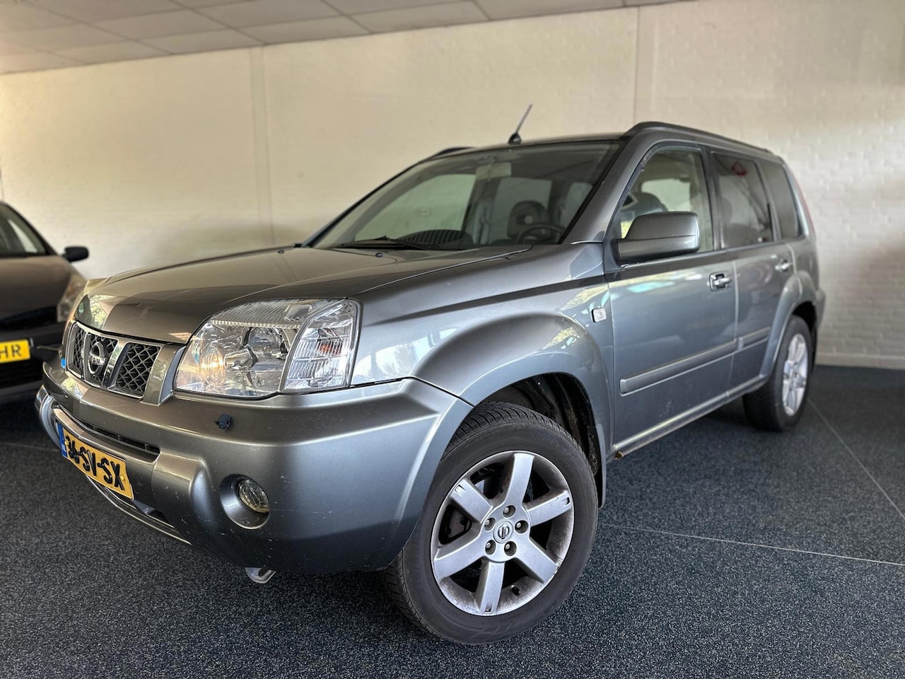 Nissan X-Trail - 2.5 Elegance | Trekhaak | Stoelverwarming | Leder | Airco | Pano | Navi | Cruise | ORG NL - AutoWereld.nl