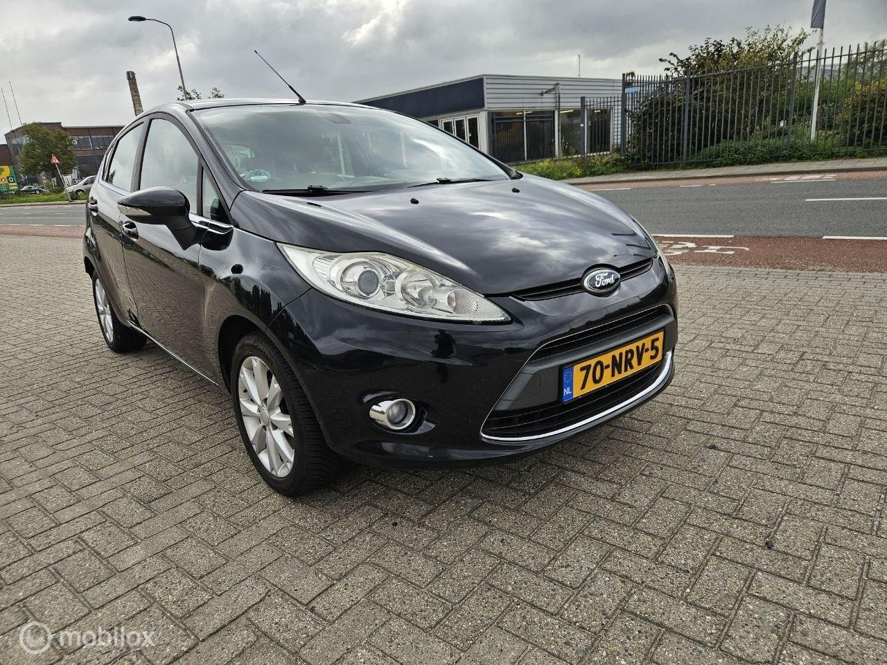Ford Fiesta - 1.25 Ghia 1.25 Ghia - AutoWereld.nl