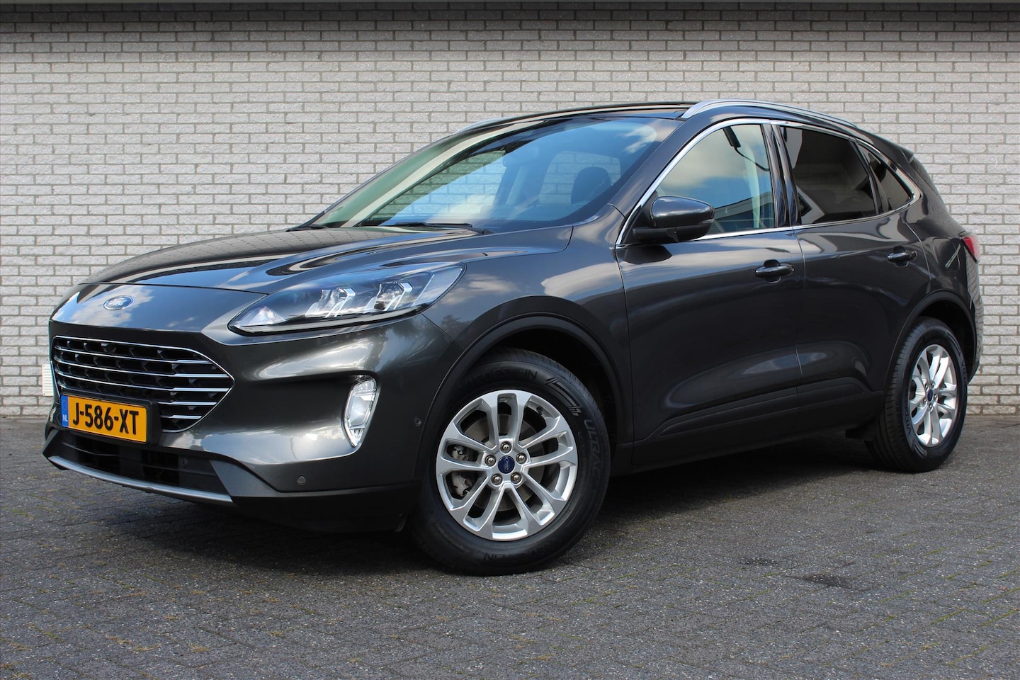 Ford Kuga - 1.5 EcoBoost Titanium | Panodak | Camera | ACC | Climate | Stoelverw. v+a | Stuurverw. | E - AutoWereld.nl