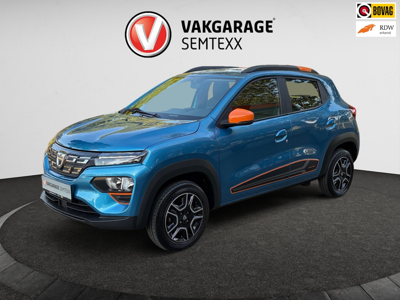 Dacia Spring - Comfort Plus (Orange Pack) 27 kWh | Automaat | Airco | Cruise | Navi | Leder | Camera | Ap - AutoWereld.nl