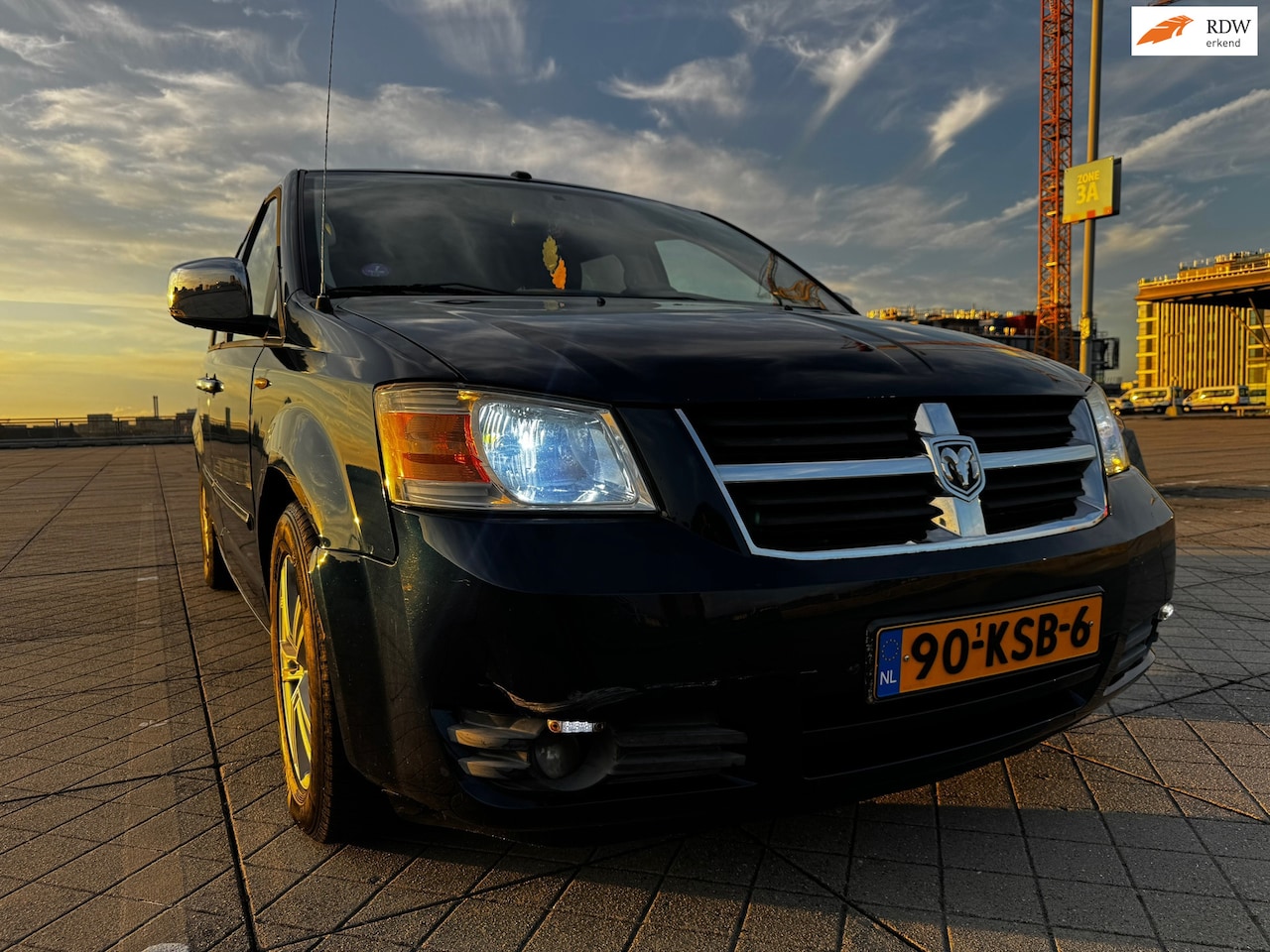 Dodge Grand Caravan - 4.0 V6 LPG 7P CRUIS CLIMA NAVI SCHUIFDAK - AutoWereld.nl