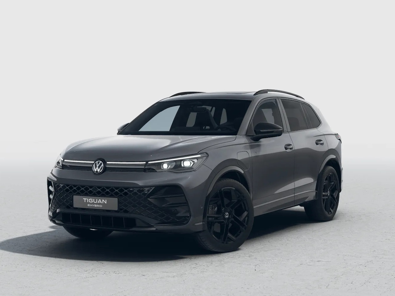 Volkswagen Tiguan - R-Line Edition 1.5 eHybrid 272 PK | Black Style | 20" inch velgen | Panoramadak | Navigati - AutoWereld.nl