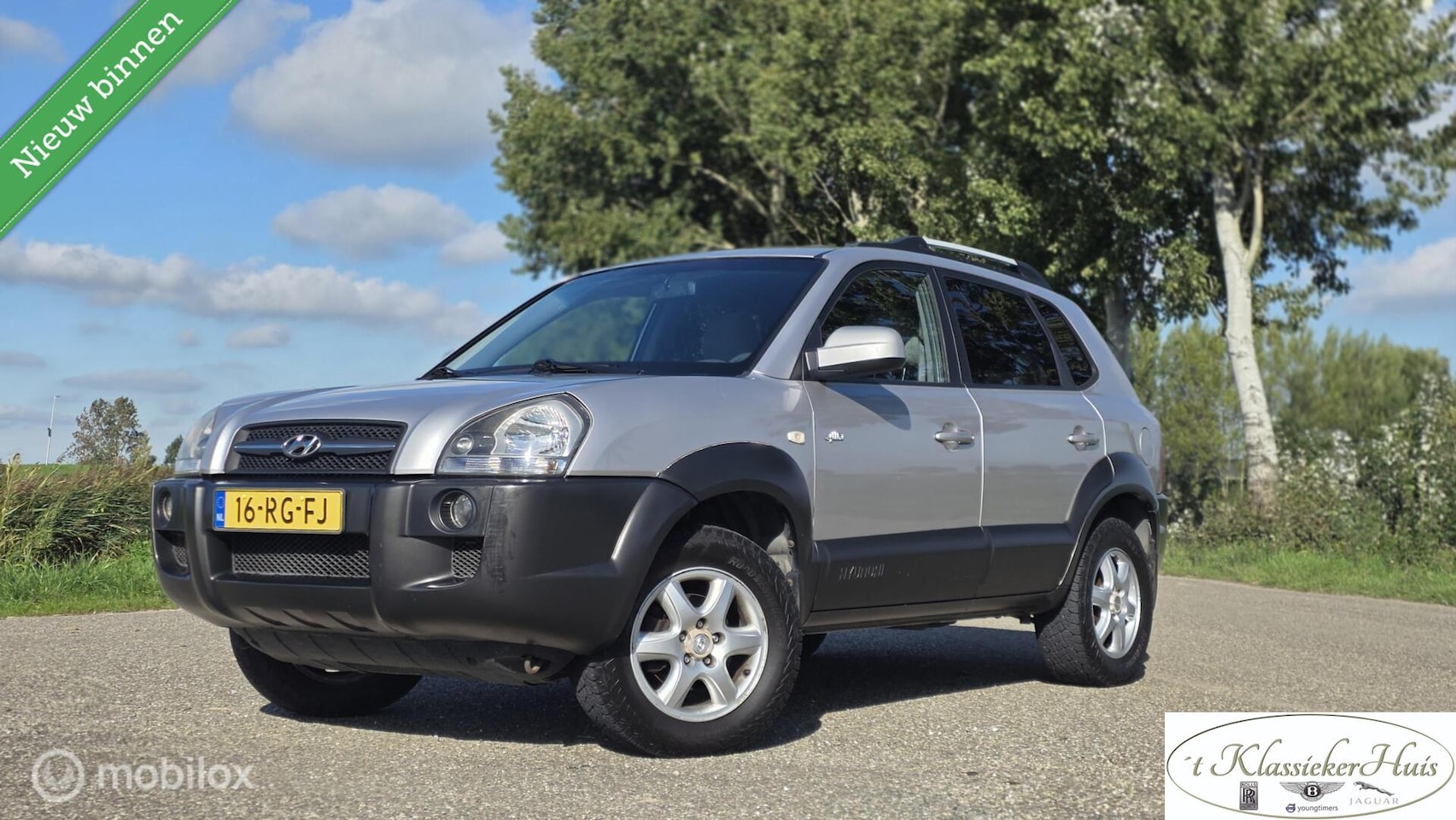 Hyundai Tucson - 2.0i 4WD Style airco lage kilometerstand! - AutoWereld.nl