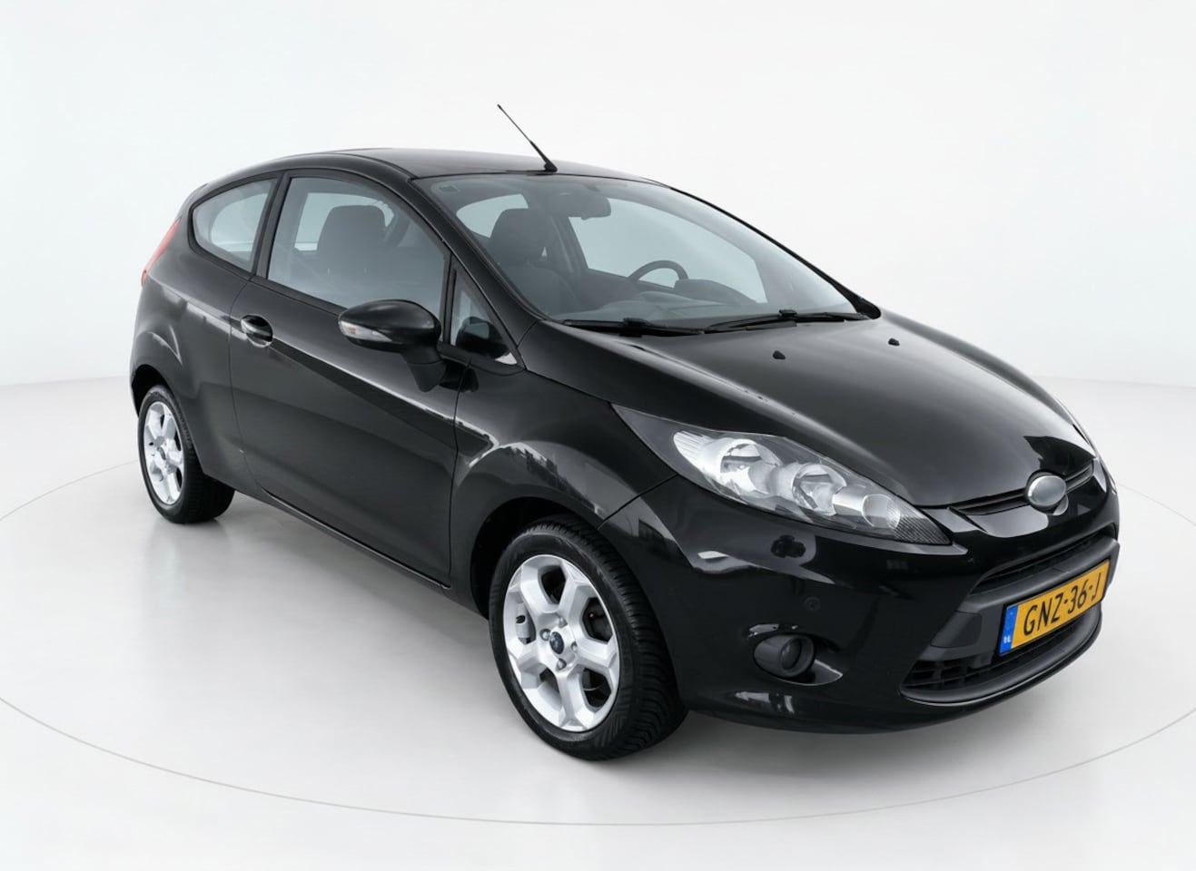 Ford Fiesta - 1.25 Ghia Airco-PDC - AutoWereld.nl