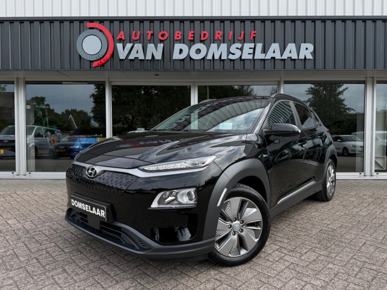 Hyundai Kona - EV Fashion 64KWH Premium - SOH 97 Navi Carplay Camera HUD - AutoWereld.nl