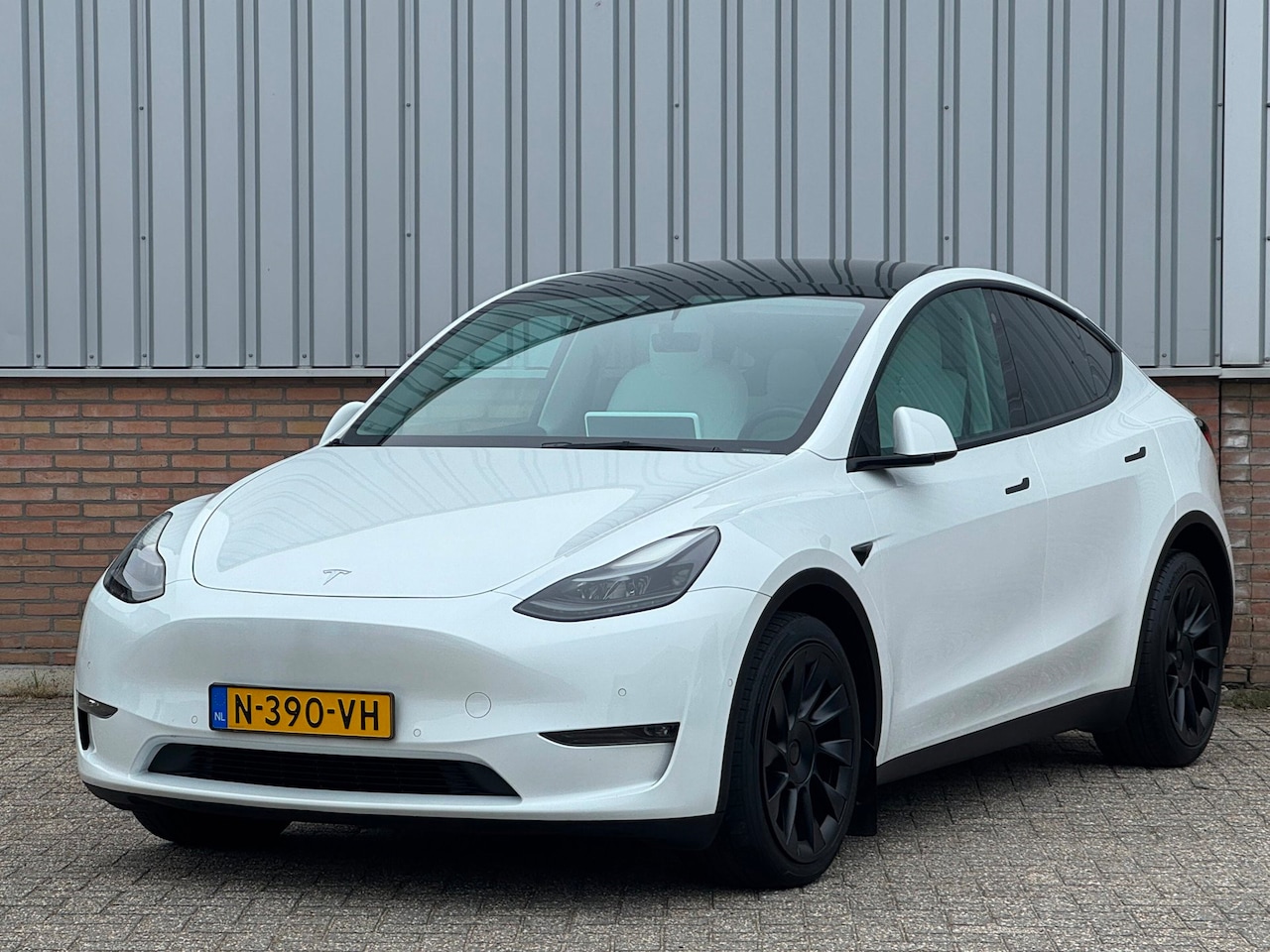 Tesla Model Y - Long Range AWD 75 kWh 90,8% SoH/ Trekhaak/ 20' inch/ Wit leder - AutoWereld.nl
