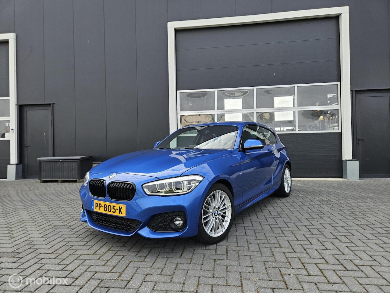 BMW 1-serie - 118i M-Pakket Estorilblau | 180PK | M140i | PDC - AutoWereld.nl