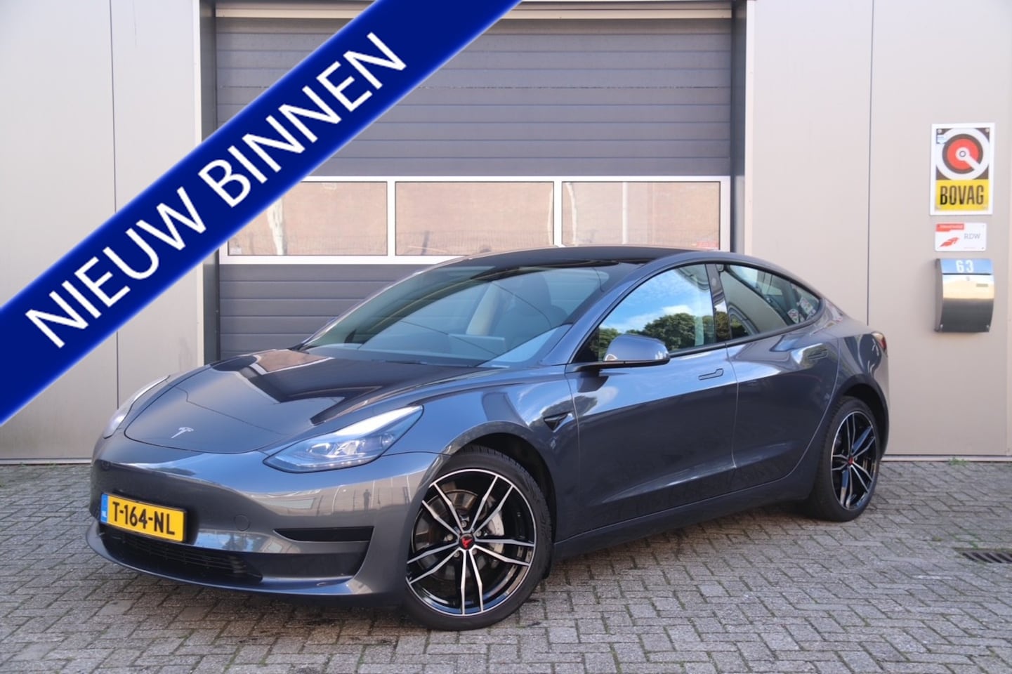 Tesla Model 3 - Standard RWD Plus 60 kWh, Stoel & Stuurverwarmd, Camera, Trekhaak, Navi - AutoWereld.nl