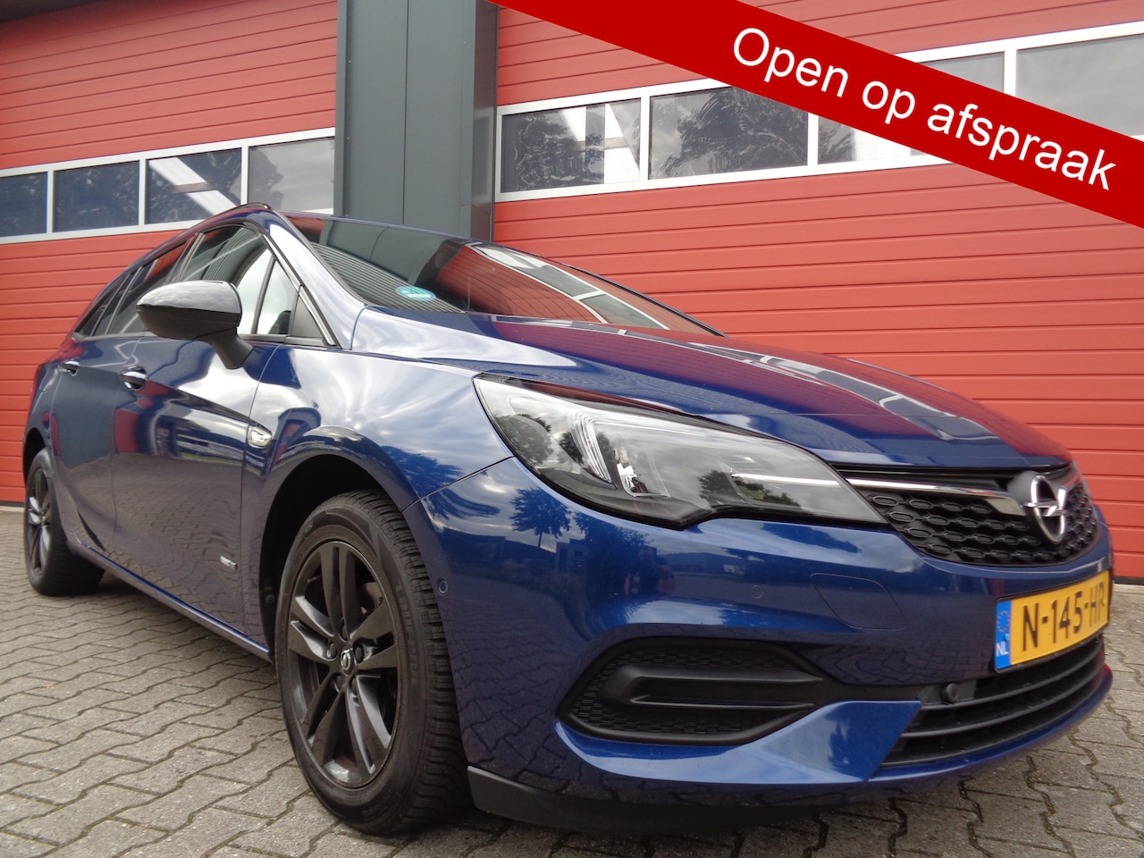 Opel Astra Sports Tourer - 1.2 Design & Tech 110PK Clima Cruise LMV 6-BAK NL-Auto 132Dkm NAP !!! - AutoWereld.nl