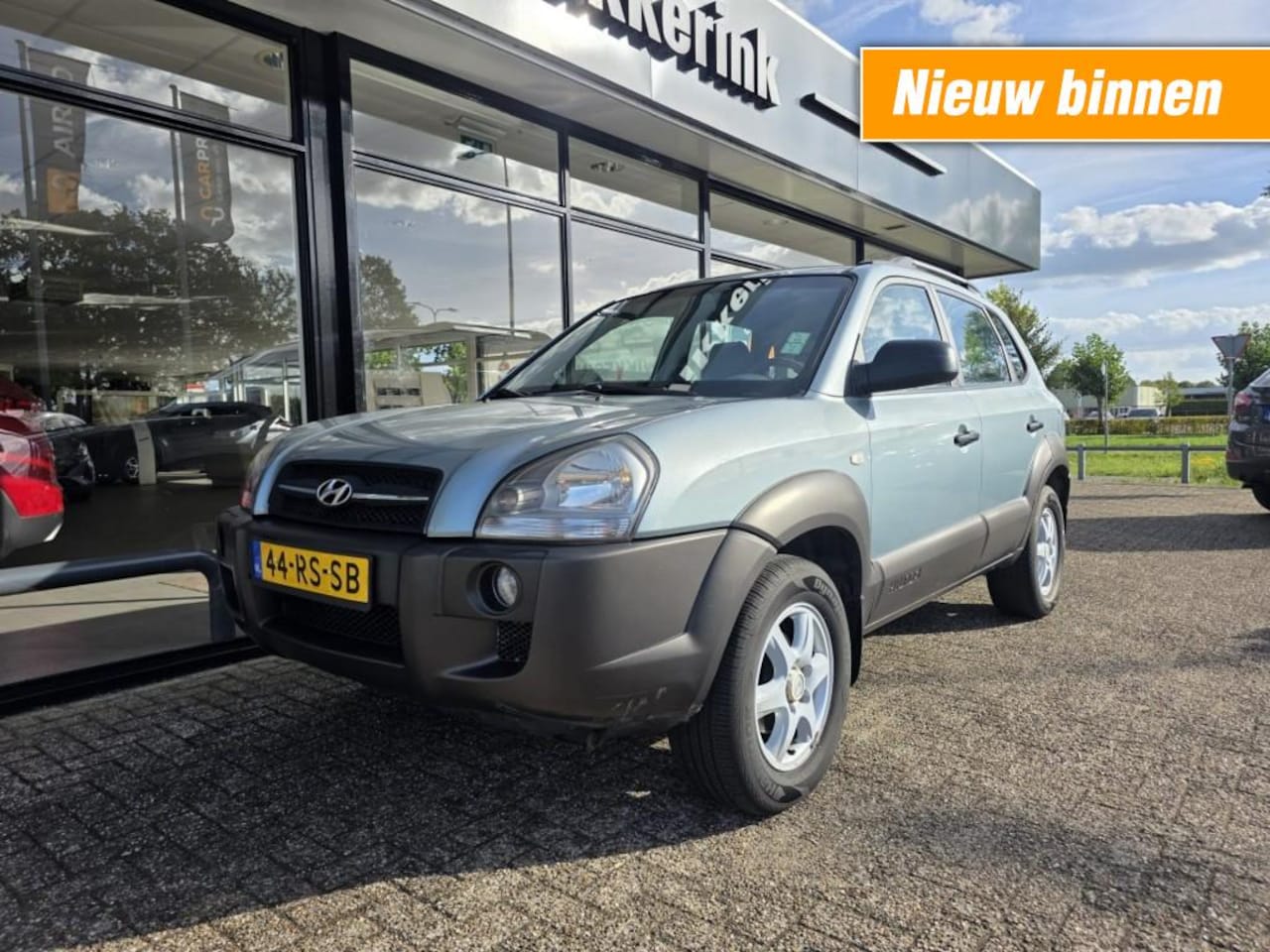 Hyundai Tucson - 2.0I ACTIVE AIRCO/TREKHAAK - AutoWereld.nl