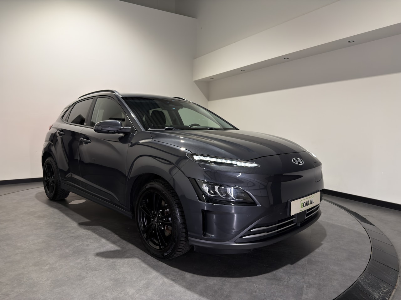 Hyundai Kona Electric - EV Premium 64 kWh | Keyless | Elektrische stoelen | Stoelen & stuur verwarmd - AutoWereld.nl