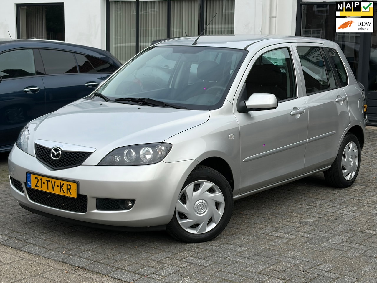 Mazda 2 - 1.4 Touring 1.4 Touring, NL-auto,Airco,Elektr.ramen,Stuurbekrachtiging,Parkeersensoren - AutoWereld.nl
