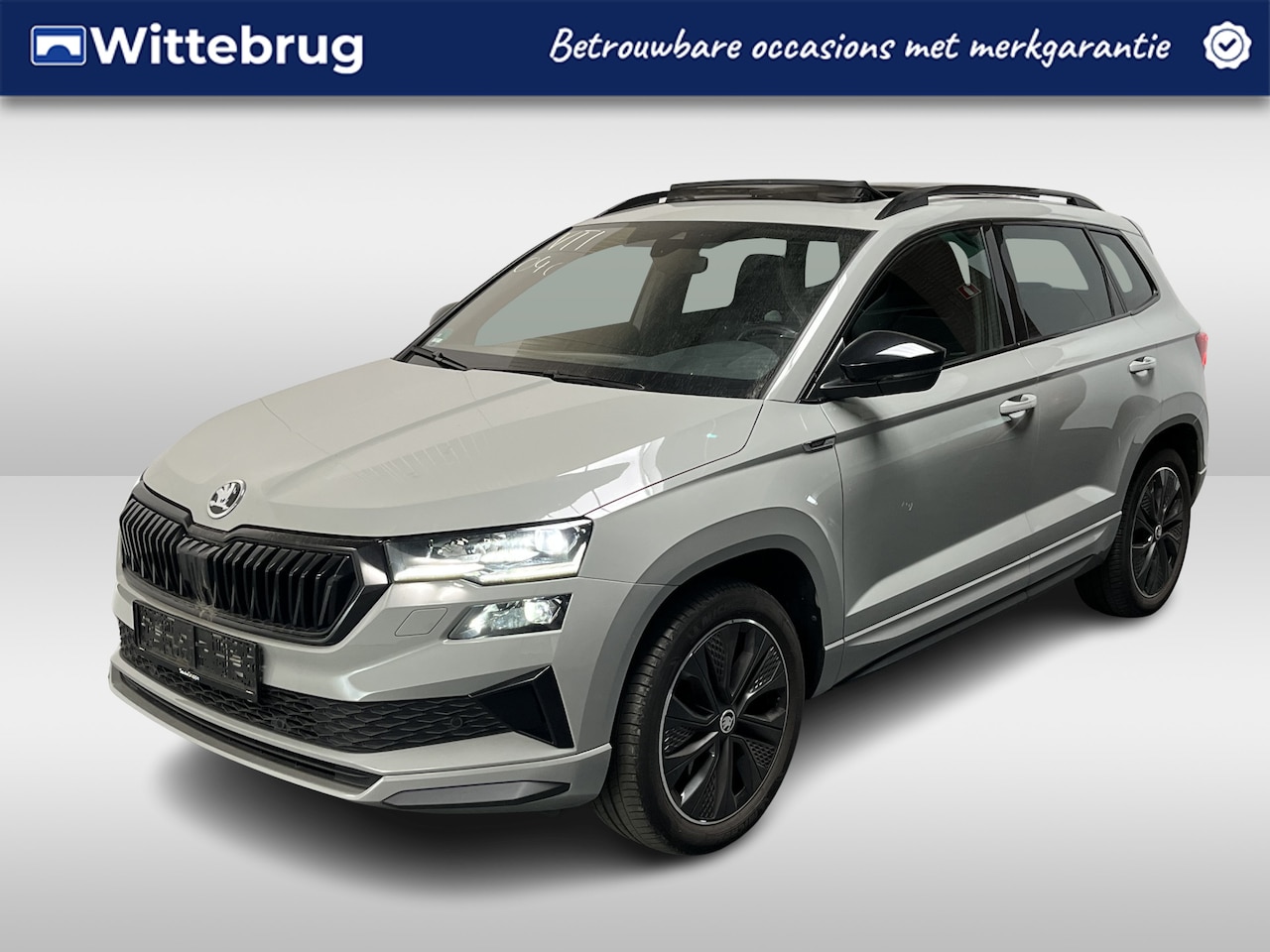 Skoda Karoq - 1.5 TSI ACT Sportline Business / AUTOMAAT/ PANO/ CAMERA/ PARK. SENSOREN/ CRYSTAL LED/ KEYL - AutoWereld.nl