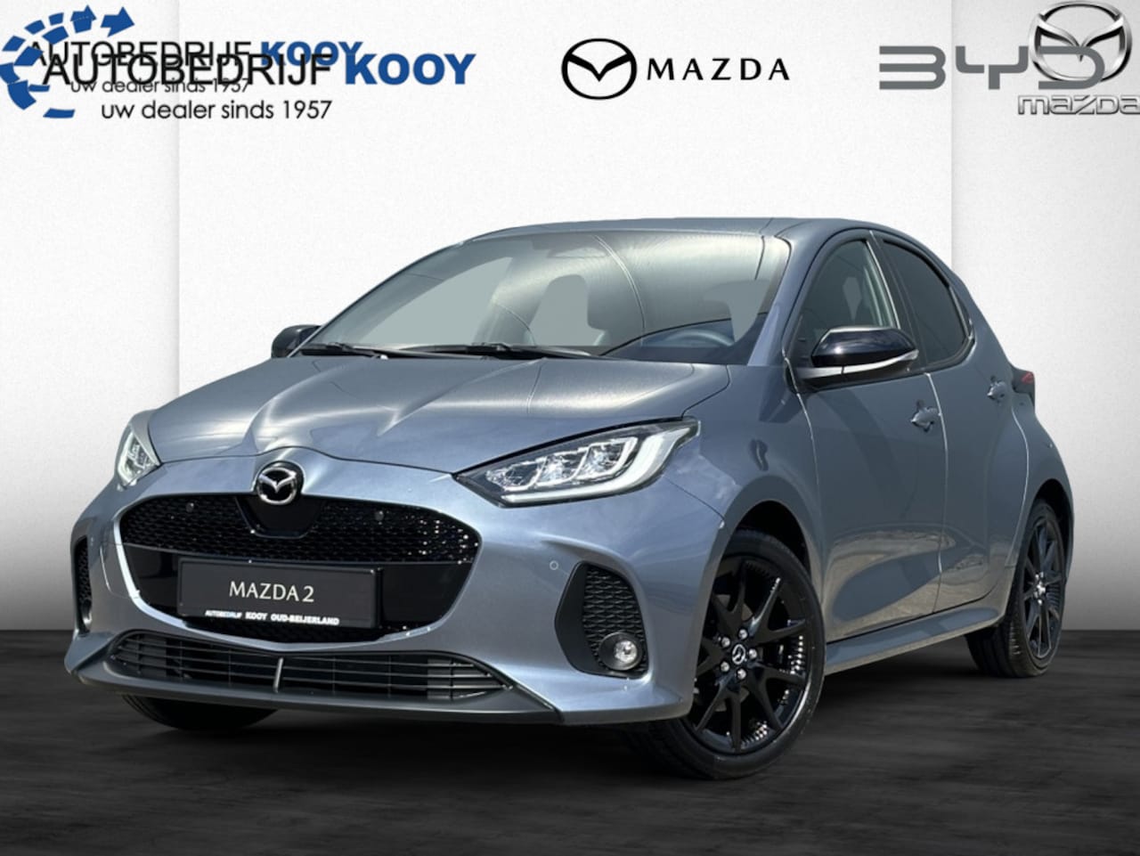 Mazda 2 Hybrid - 1.5 Homura / Uit Voorraad Leverbaar! / Nieuwe kleur: Sky Grey - AutoWereld.nl