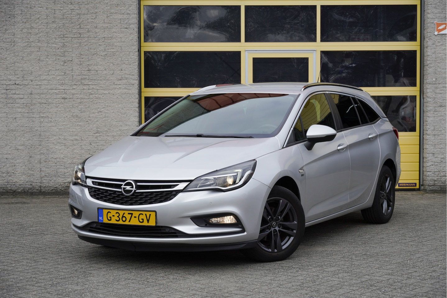 Opel Astra Sports Tourer - 1.0 Turbo 120 Jaar Edition BJ2019 Lmv 16" (Zwart) | Led | Pdc | App-Connect | Navi | Clima - AutoWereld.nl