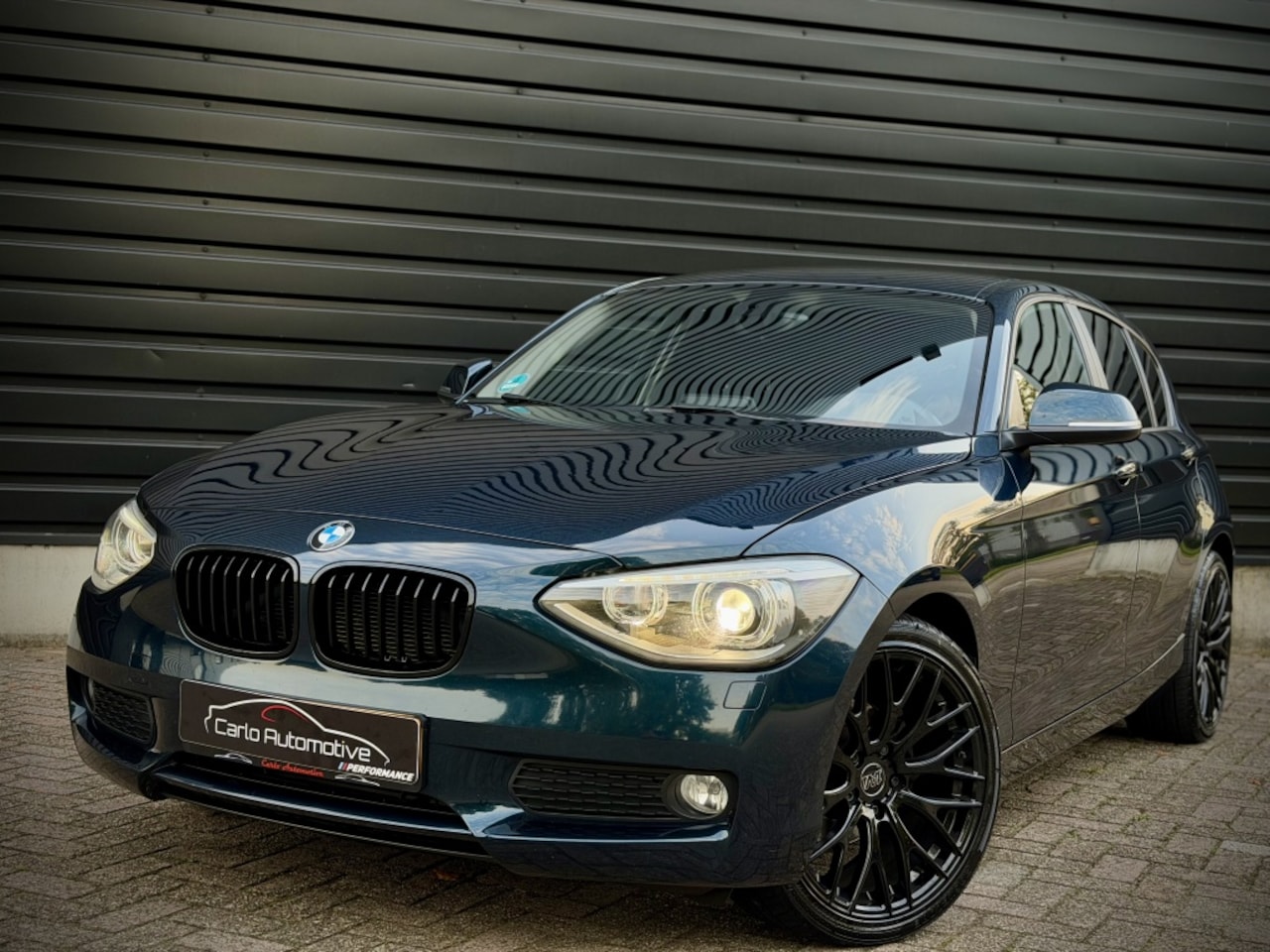 BMW 1-serie - 116i Executive AUT|CLIMA|XENON|NAVI|PDC - AutoWereld.nl