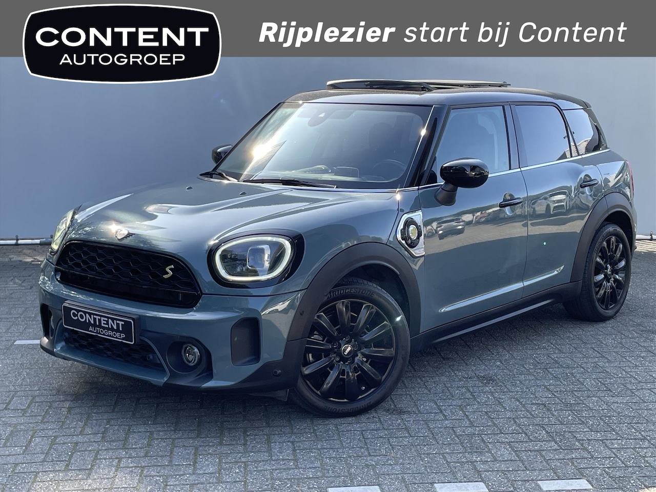 MINI Countryman - 1.5 P-Hev Cooper S E / elektrische stoelen met geheugen / stoelverwarming / pano - AutoWereld.nl