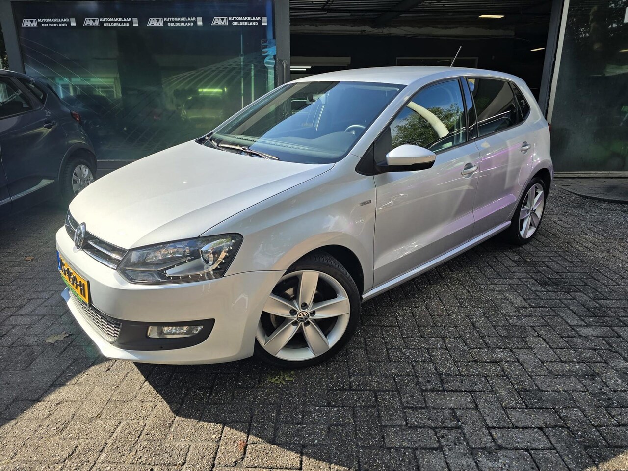 Volkswagen Polo - 1.2 Easyline | 3/6 OF 12MND GARANTIE | NAVI | NW APK | LMV | CRUISE | - AutoWereld.nl