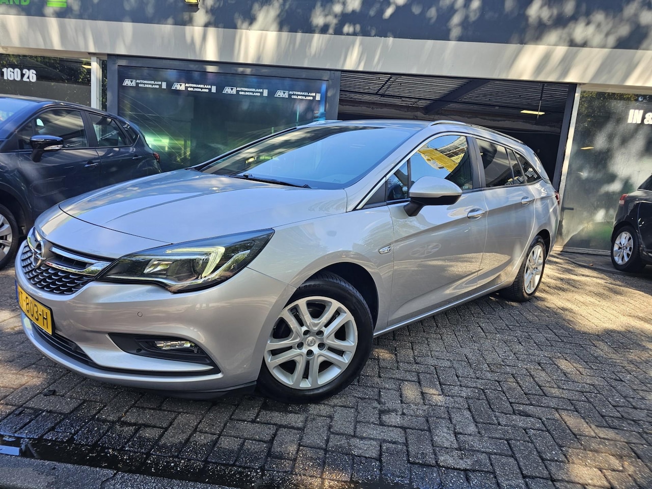 Opel Astra Sports Tourer - 1.0 Business+ | 2E EIGENAAR | NW APK | STOELVERWARMING | TREKHAAK | LMV | - AutoWereld.nl
