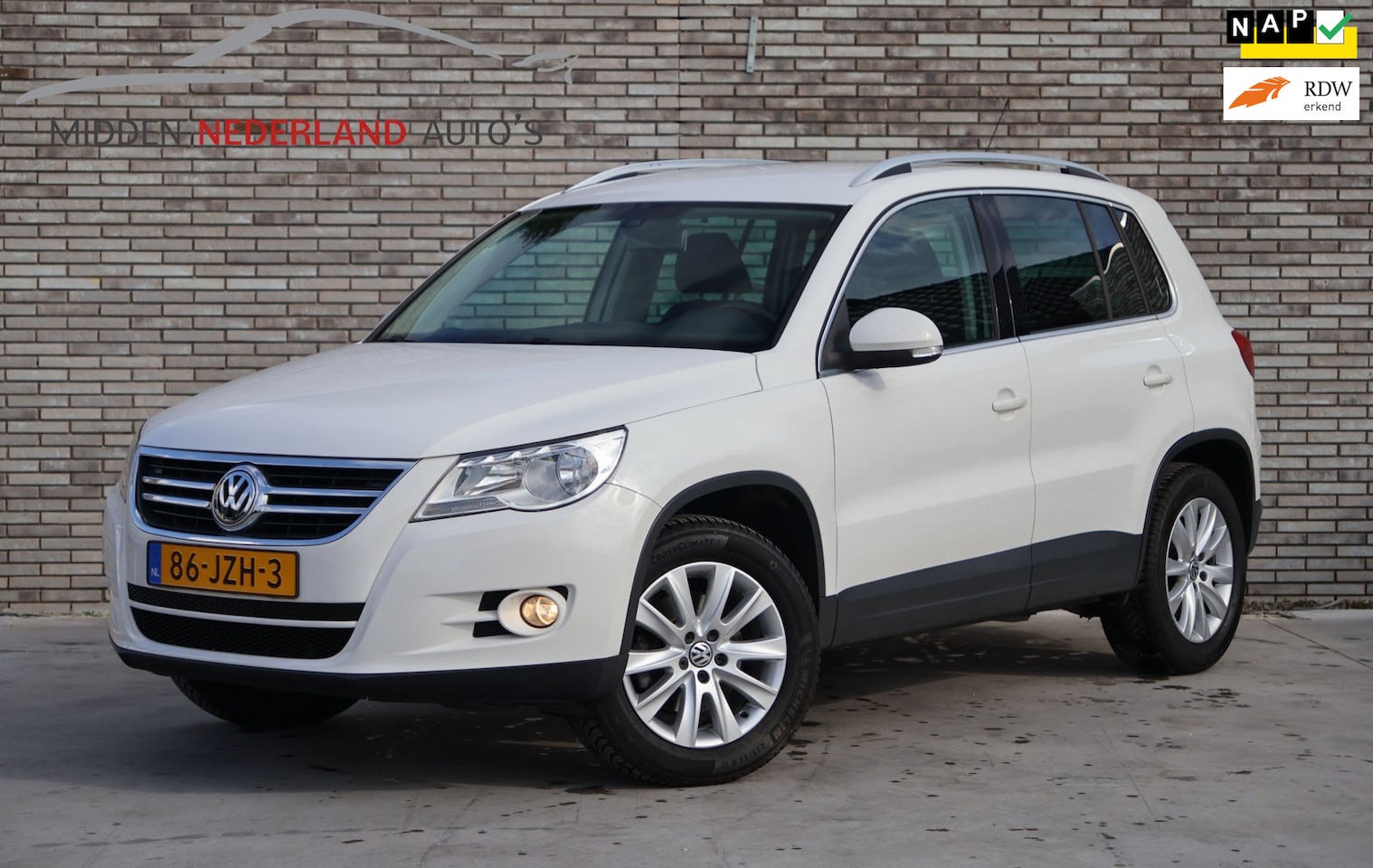 Volkswagen Tiguan - 1.4 TSI Sport&Style * PDC * NETTE STAAT * NAP PAS * APK 2027 * - AutoWereld.nl