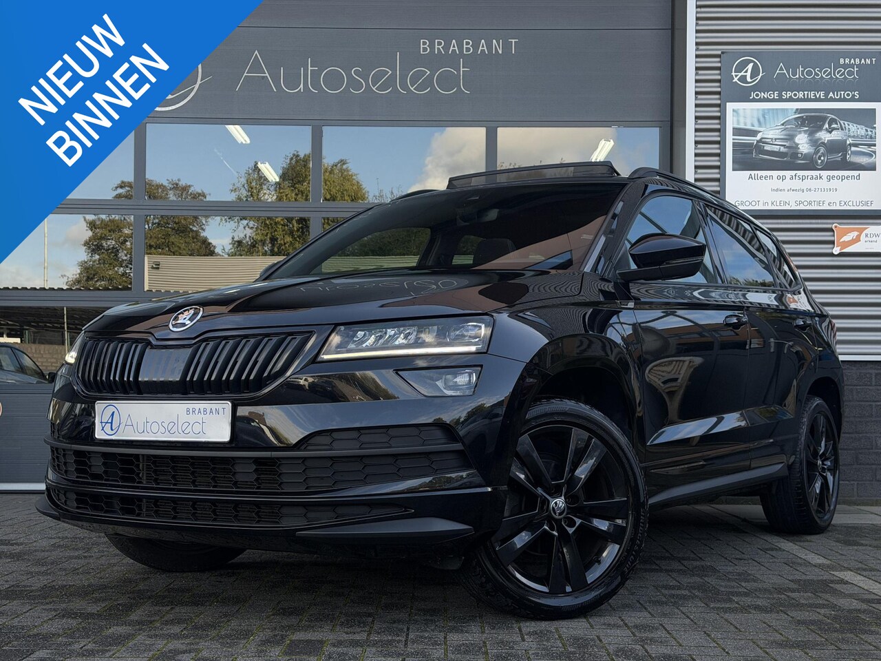 Skoda Karoq - 1.5 TSI ACT Sportline Pano | CarPlay | Trekhaak - AutoWereld.nl