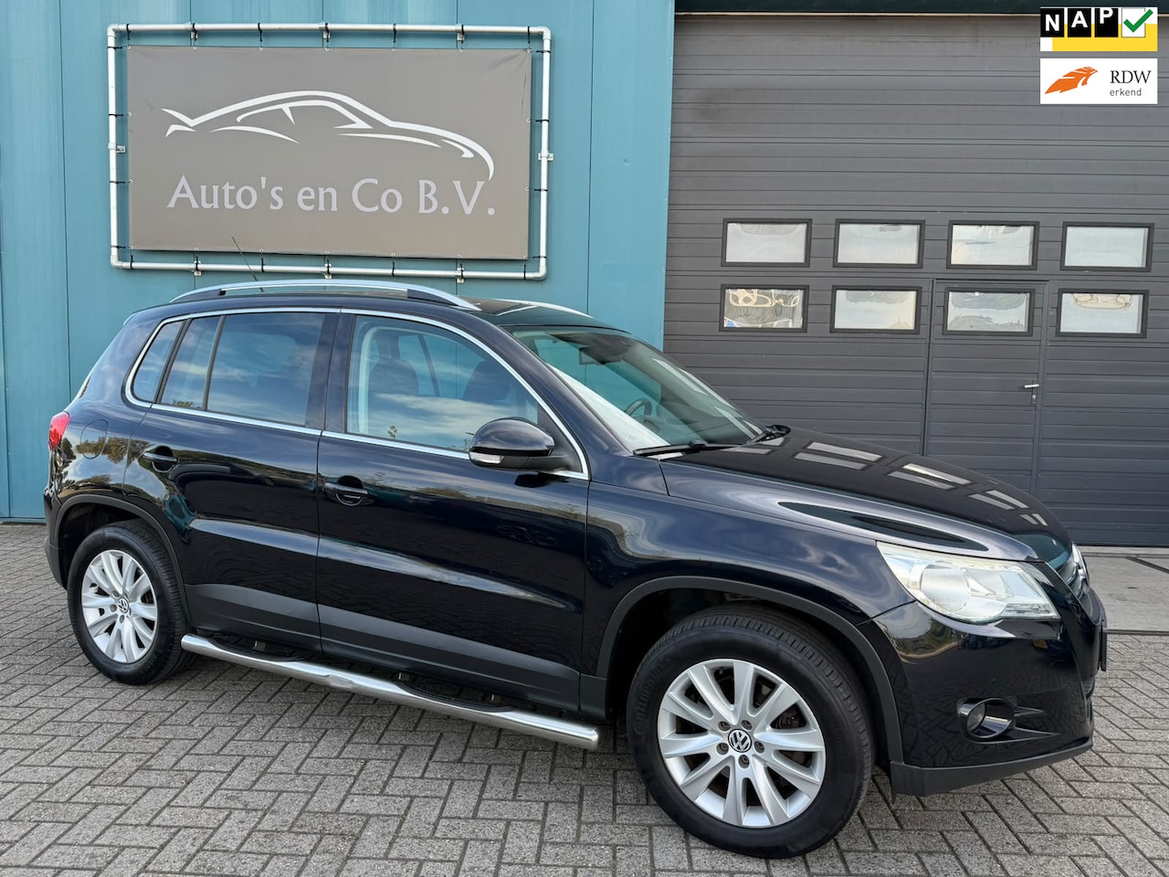 Volkswagen Tiguan - 2.0 TSI Sport&Style 4Motion Clima Cruise Navigatie 17" Lm velgen Trekhaak NL Auto NAP - AutoWereld.nl
