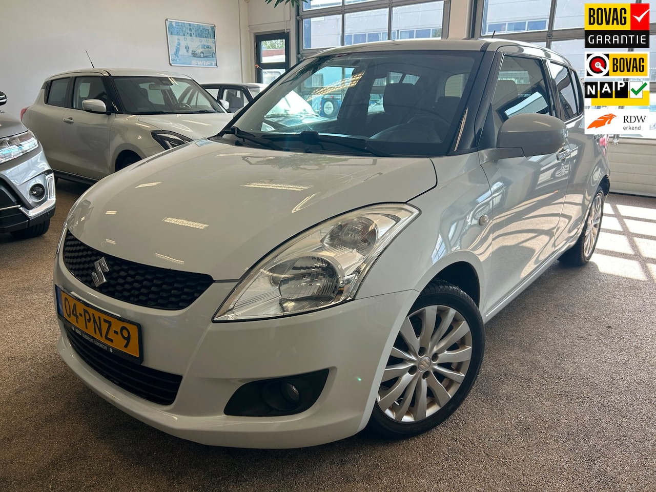 Suzuki Swift - 1.2 Exclusive EASSS 5-drs Airco| Bluetooth| Stoelverwarming - AutoWereld.nl