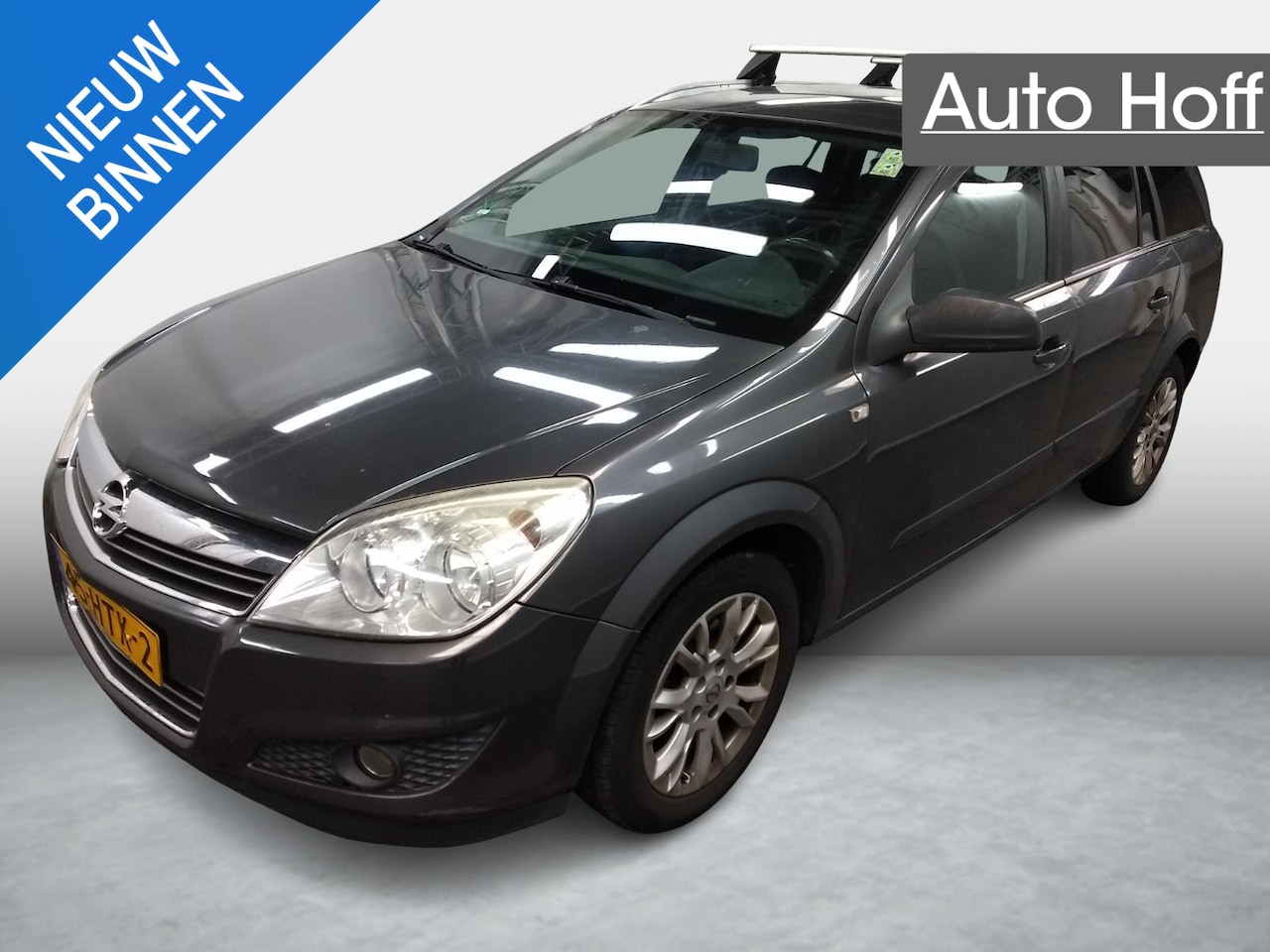 Opel Astra Wagon - 1.4 Business | Navi | Airco | Cruise Control | LMV | PDC | Trekhaak | Privacy Glass | APK - AutoWereld.nl