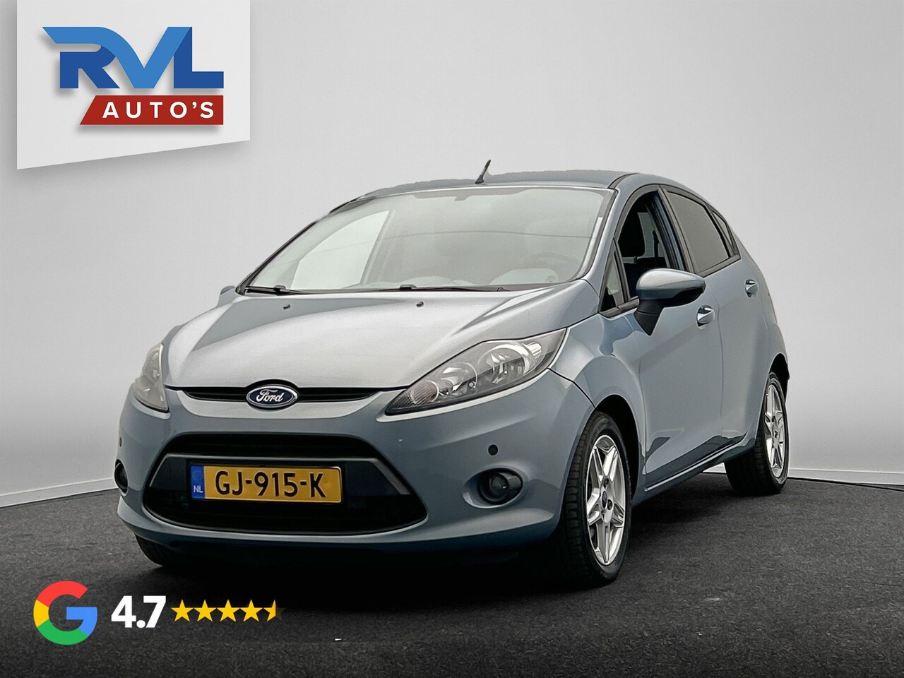 Ford Fiesta - 1.4 Ghia Automaat | Lichtmetaal | Airco | Cruise-control | PDC | - AutoWereld.nl