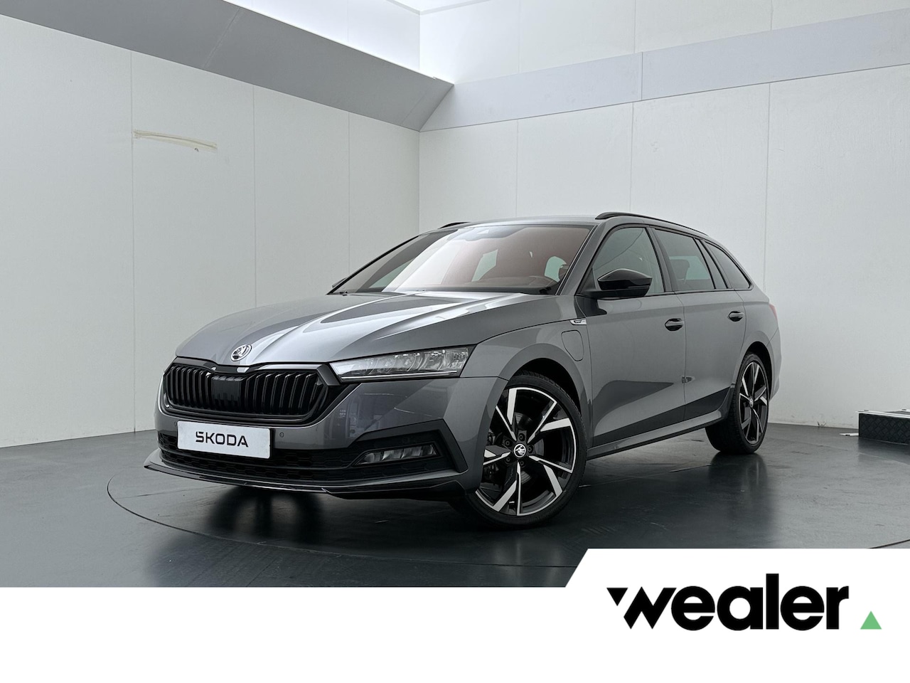 Skoda Octavia Combi - 1.4 TSI iV PHEV Sportline Business | 204 PK | SoH 100% | Adaptive Cruise Control | Achteru - AutoWereld.nl