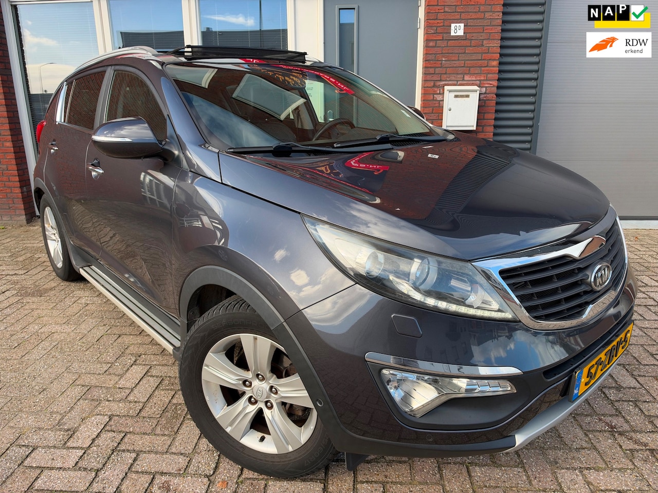 Kia Sportage - 1.6 GDI Super Pack / Leder / Camera / TV Scherm / Pano / Navi / PDC / LED - AutoWereld.nl