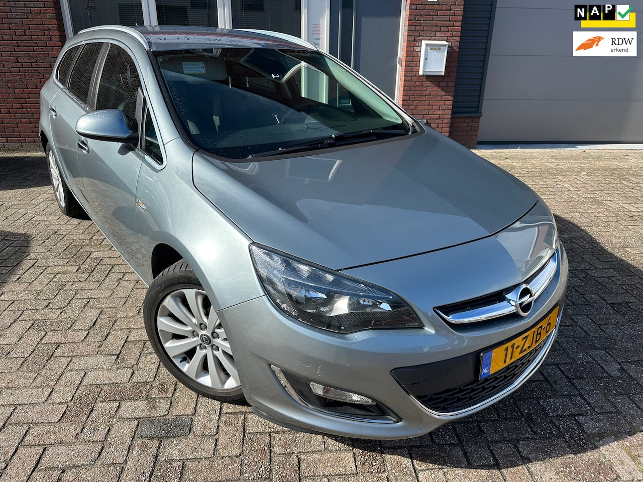 Opel Astra Sports Tourer - 1.4 Turbo Sport / Navi / PDC / Leder / Cruise / NAP - AutoWereld.nl